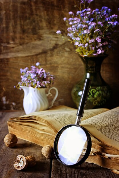 Magnifying glass and old book