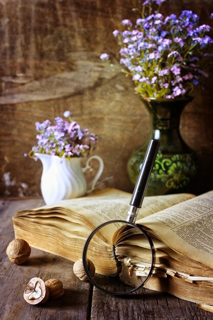 Magnifying glass and old book