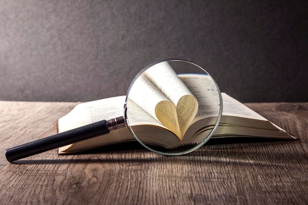 a magnifying glass on a open book