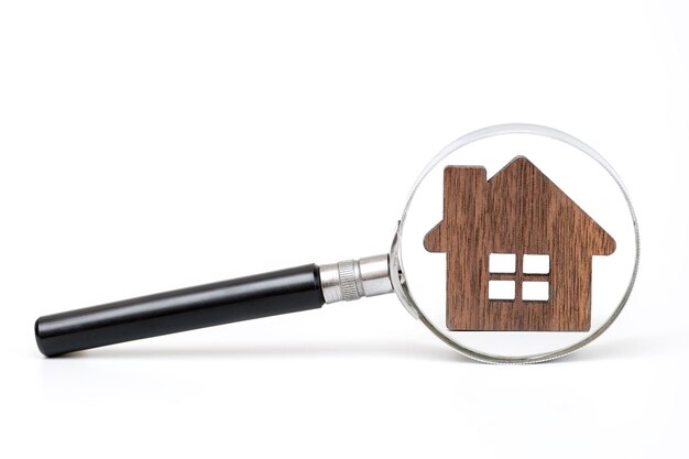 A magnifying glass with a house on it