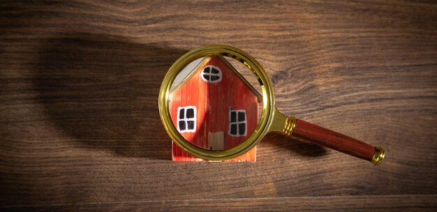 Magnifying glass with a house model Real estate Inspection