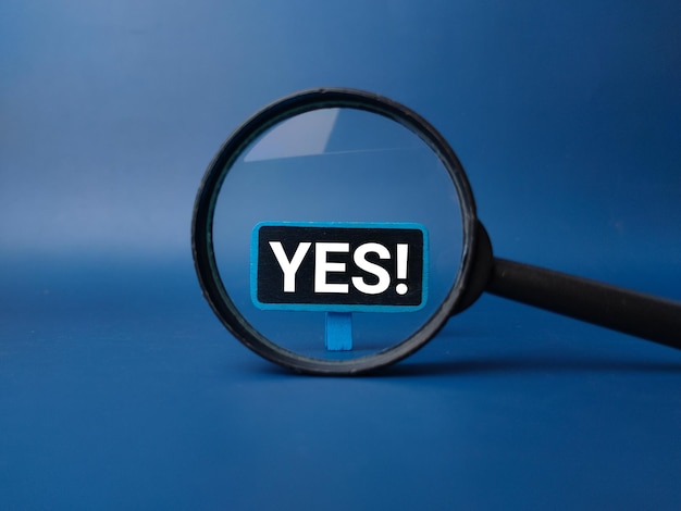 Magnifying glass with the word YES