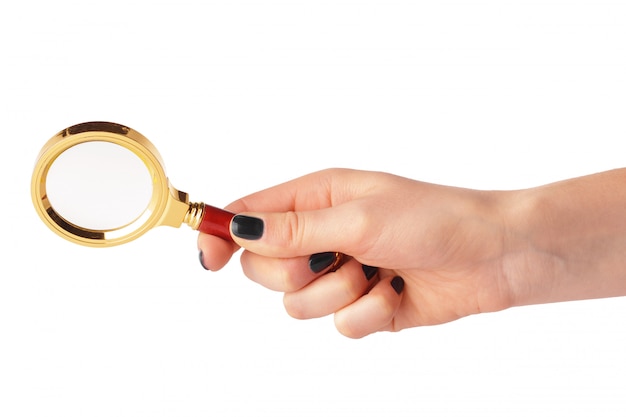 Magnifying glass in a woman hand