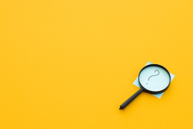 Magnifying glass on yellow background Search concept