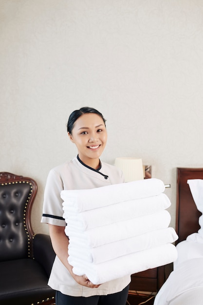Maid with towels at hotel