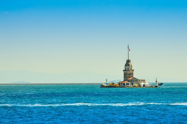 Maiden tower at bosphorus against clear sky