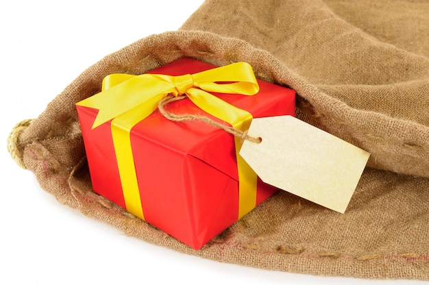 Mail bag with red gift and label.