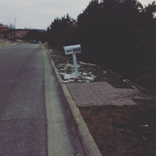 Photo mailbox on footpath by street