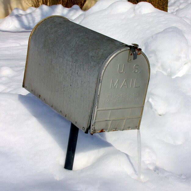 Mailbox in snowback with icicle