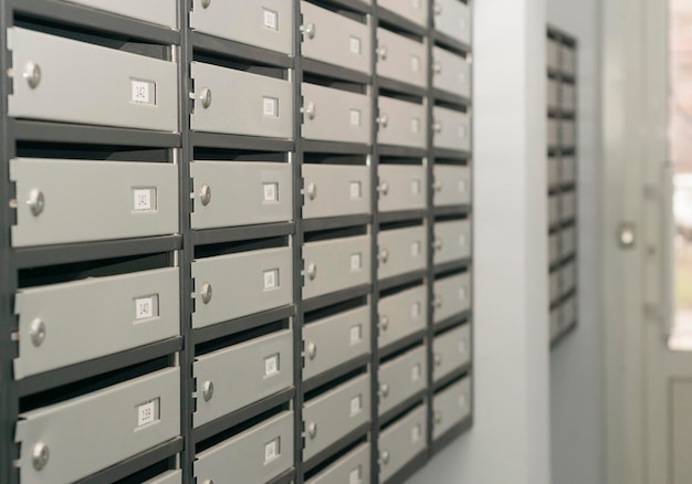 Photo mailboxes filled with numbers in an apartment building 3