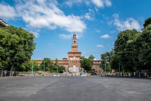 Main entrance to the Sforza Castle Castello Sforzesco and fountain in front of it Milan Italy