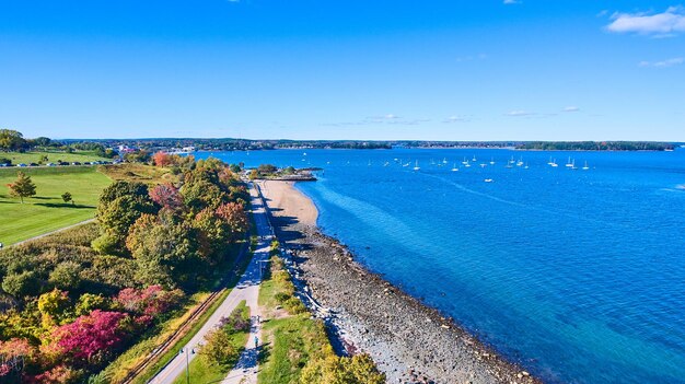 Maine coastline with ocean views boats and forest trails