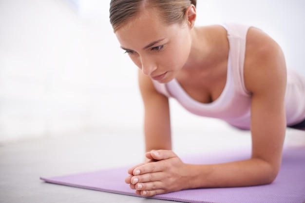 Maintaining her focus with yoga An attractive young woman working out