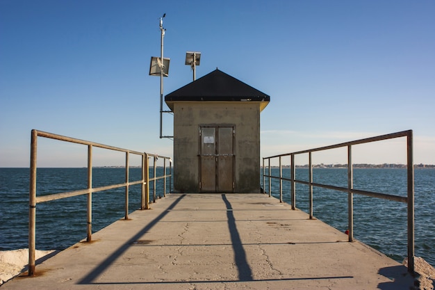 A maintenance cabin in a dam to the sea in Italy.