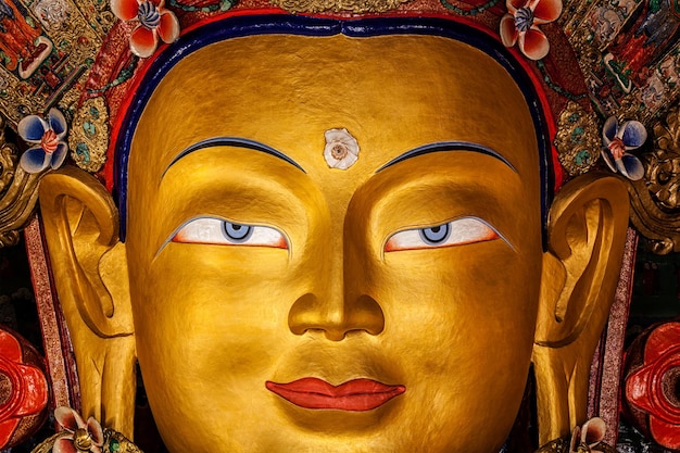 Maitreya Buddha statue face close up in Thiksey Gompa Ladakh India