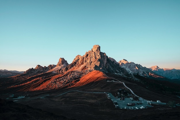 Majestic mountain peak back lit by sunset