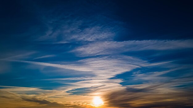 A majestic winter sunset with swirls of clouds