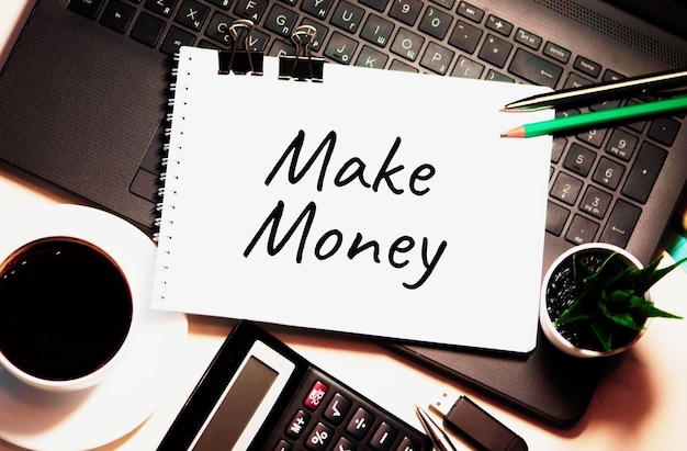 Photo make money is written on white piece of paper money cash banking financial investment wealth concept