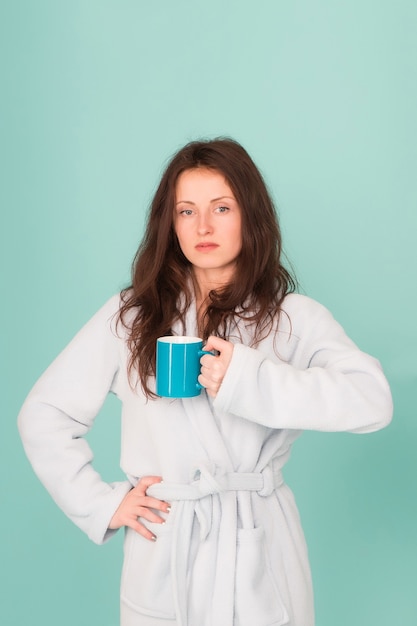 Make morning better. she feel rested. everyday routine begins from coffee. need some energy. tea time at home. good morning. morning girl in bathrobe drink coffee. woman coffee cup. relax in morning.