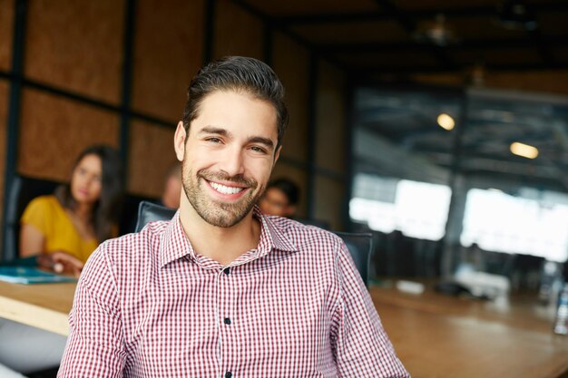 Make today so awesome yesterday gets jealous Portrait of an office worker in a meeting with colleagues in the background