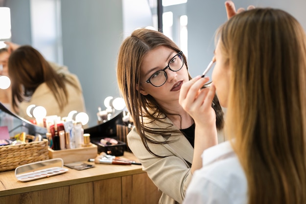 Make-up artist applying eyeshadow