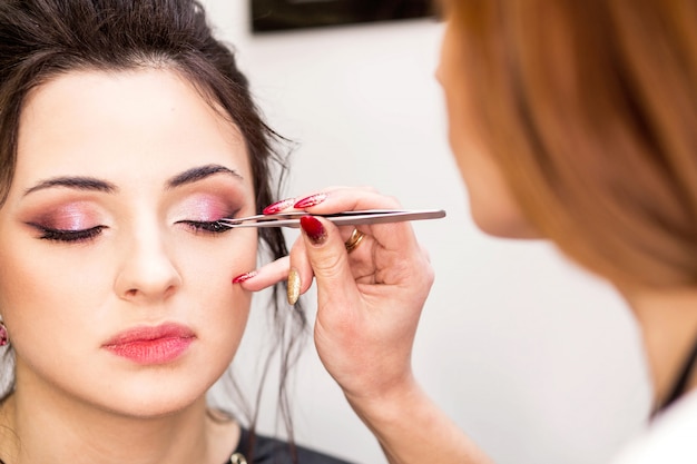 Make-up artist does make-up for the model