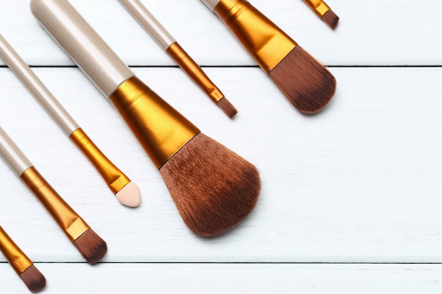 Photo make up brushes on wooden white desk