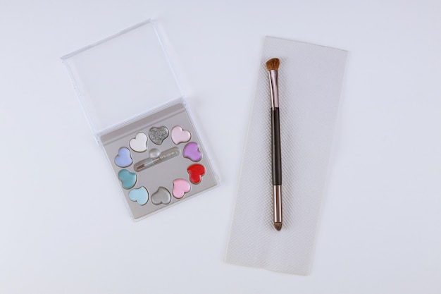 Make up Eye shadow palette with brush on isolated white table