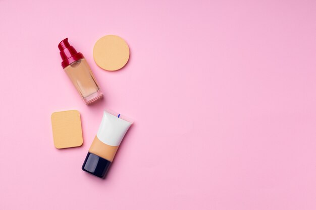 Make up foundation pack on pink top view