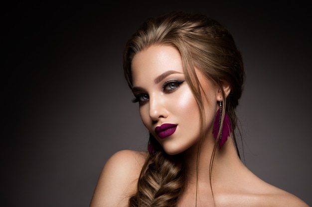 Make up. Glamour portrait of beautiful woman model with fresh makeup and romantic hairstyle.