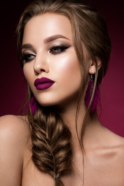 Make up. Glamour portrait of beautiful woman model with fresh makeup and romantic hairstyle.