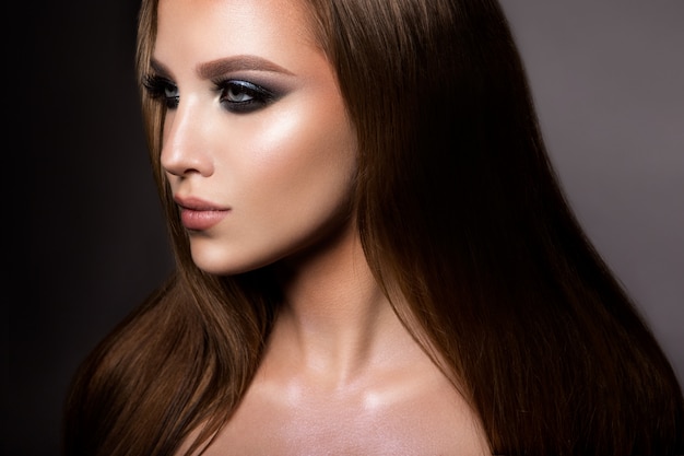 Make up. Glamour portrait of beautiful woman model with fresh makeup and romantic hairstyle.