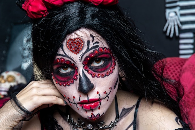 Make-up model with theme Mexican Day of the Dead in a study session in madrid, spain
