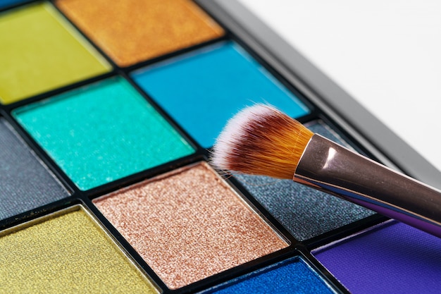 Make-up palette and brushes. Professional eyeshadow palette. Close up.