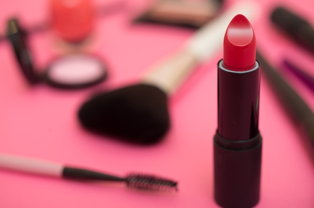 Make-up products and tools. Pink background