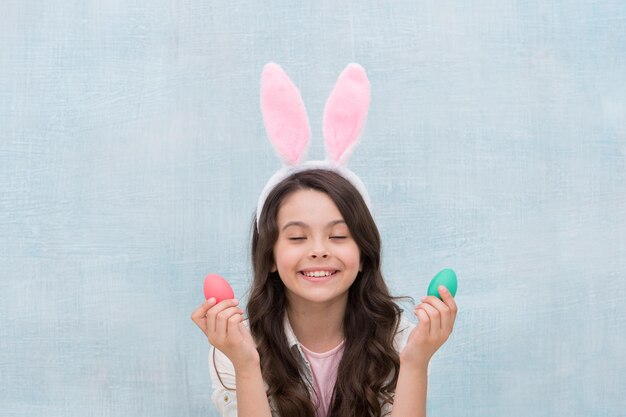 Make a wish Girl with Easter eggs and bunny Happy easter Pretty little girl preparing for Easter easter egg hunt preparing for celebration its spring time Holiday gifts and presents