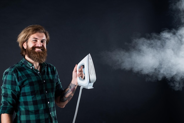 Make your choice new technology mature hipster with beard use steaming iron brutal caucasian hipster with moustache ironing male housekeeper happy shop assistant in checkered shirt bearded man