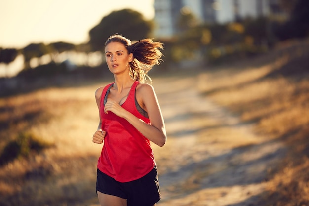 Make your heart happy Shot of a sporty young woman exercising outdoors