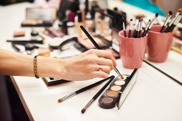 Makeup artist doing perfect make up for the young model