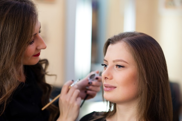 Makeup artist makes beautiful girl makeover