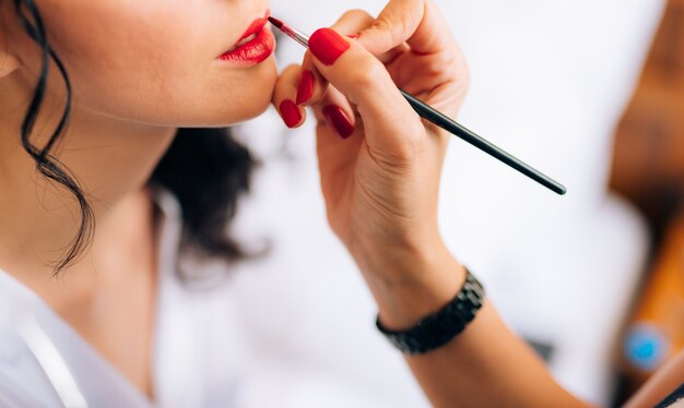 makeup artist making a make up for bride beautiful sexy