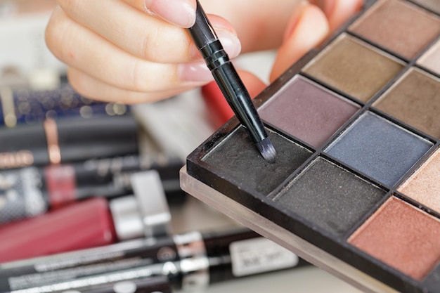 Makeup artist's working palette in hands at work