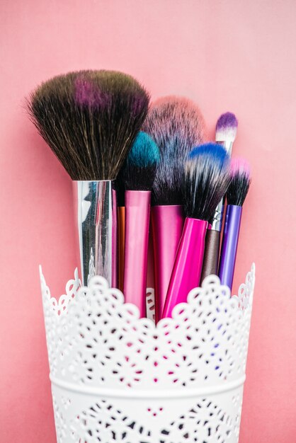 Makeup brush isolated on pink background