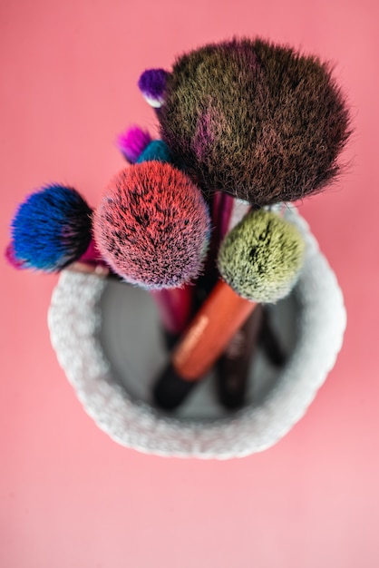 Makeup brush isolated on pink background