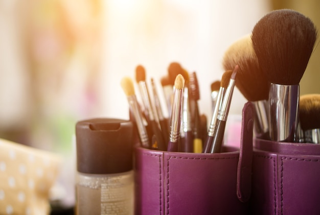 Makeup brush and sunlight background