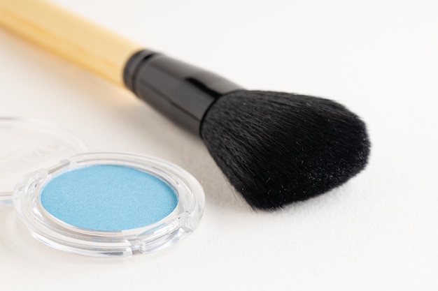 Makeup brush with blue powder