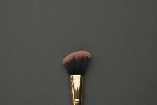 Makeup brush with red bristles. Facial care.