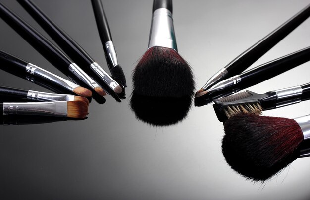 Makeup brushes on grey background