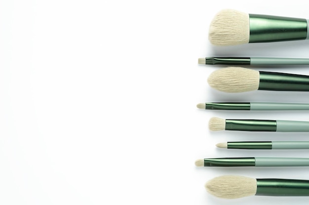 Makeup brushes on white background Top view copy space