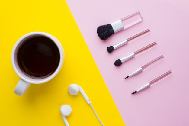 Makeup brushesand a Cup of coffee. Beauty concept